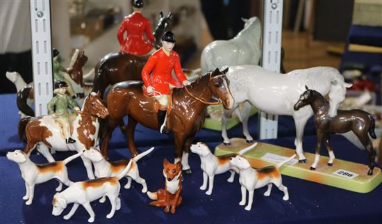 A Beswick eight piece porcelain hunting group and a horse and foal group, number 1811